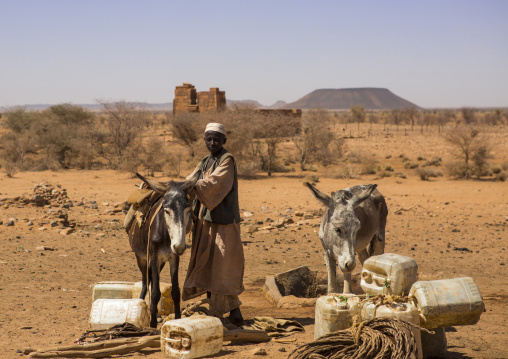 Sudan, Nubia, Naga, people taking water from a well in the desert