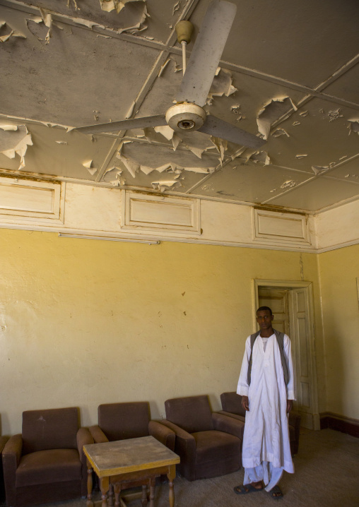 Sudan, Red Sea Hills, Erkowit, man standing in an old english house