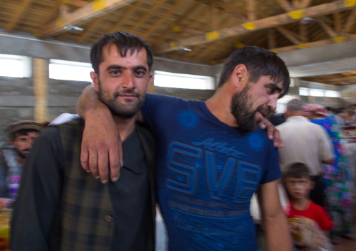 Drunk aghan men in the market border with Afghanistan where alcohol can be bought, Central Asia, Ishkashim, Tajikistan