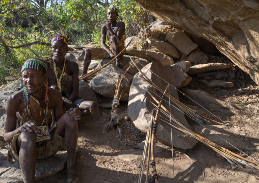 Tanzania, Serengeti Plateau, Lake Eyasi, hadzabe bushman making the arrow for a hunting bow