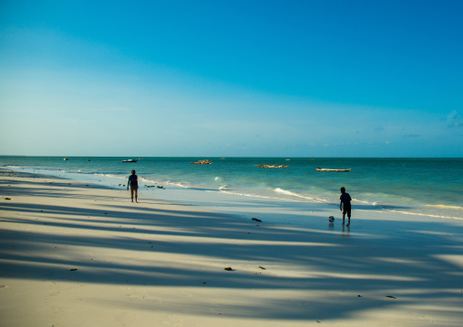 Tanzania, Zanzibar, Jambiani, children playing football on a white beach