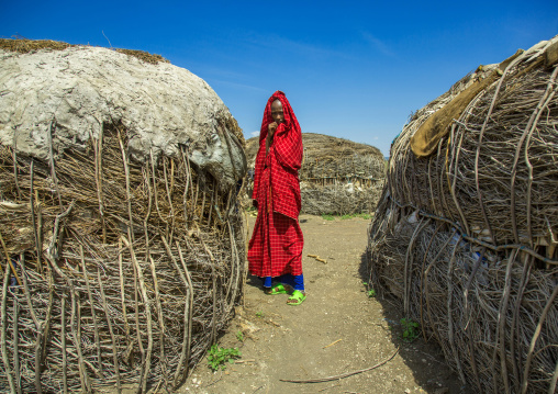 Tanzania, Ashura region, Ngorongoro Conservation Area, maasai woman outside her home