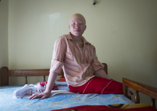 Tanzania, East Africa, Dar es Salaam, jenipher stanford a teen with albinismin in her bedroom at under the same sun house