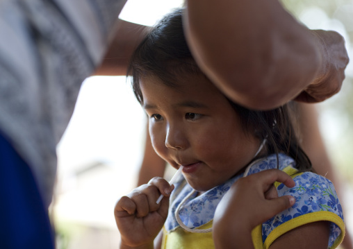 Girl during the lisu tribe string ceremony, Ban nam rin village, Thailand