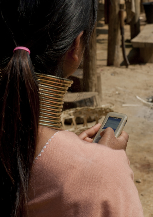 Long neck texting on phone, Thailand