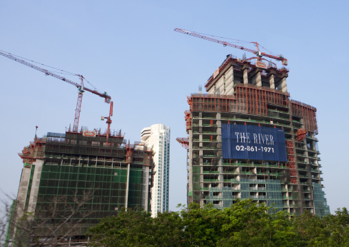 Cranes near skyscrapers, Bangkok, Thailand