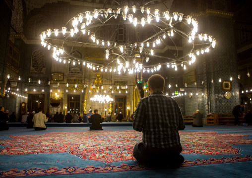 Muslim men praying inside new mosque Yeni Camii, Marmara Region, istanbul, Turkey