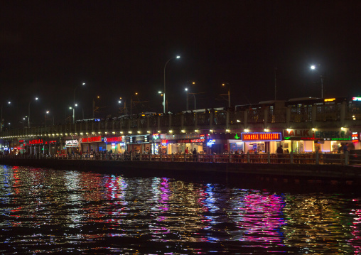 Restaurants under Galata bridge at night, Galata, istanbul, Turkey