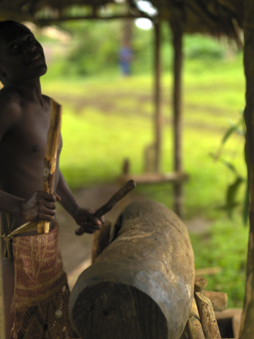 Ni-Vanuatu beating on a slit drum, Sanma Province, Espiritu Santo, Vanuatu