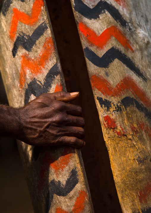 Small Nambas tribesman beating on a slit gong drum during the palm tree dance, Malekula island, Gortiengser, Vanuatu