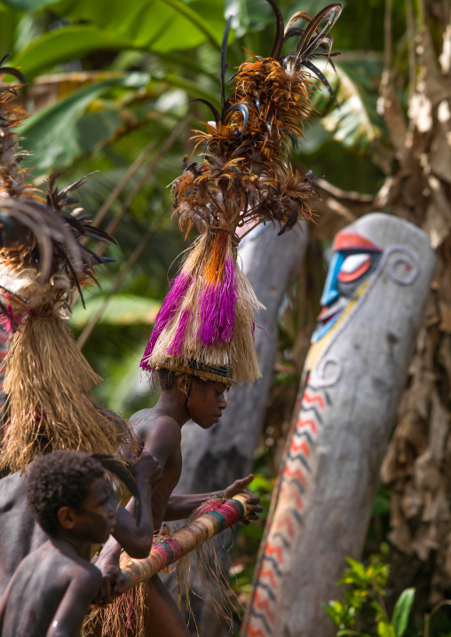 Small Nambas children dancing in front of slit gong drums during the palm tree dance, Malekula island, Gortiengser, Vanuatu