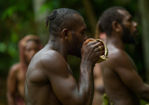 Big Nambas tribesman blowing in a shell, Malampa Province, Malekula Island, Vanuatu