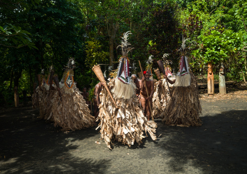 Rom dance masks and giant slit drum during a ceremony, Ambrym island, Fanla, Vanuatu