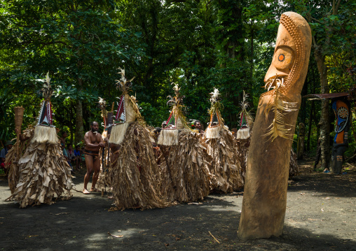 Rom dance masks and giant slit drum during a ceremony, Ambrym island, Fanla, Vanuatu