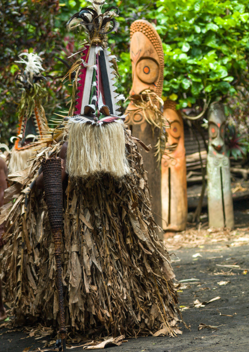 Rom dance masks and giant slit drum during a ceremony, Ambrym island, Fanla, Vanuatu