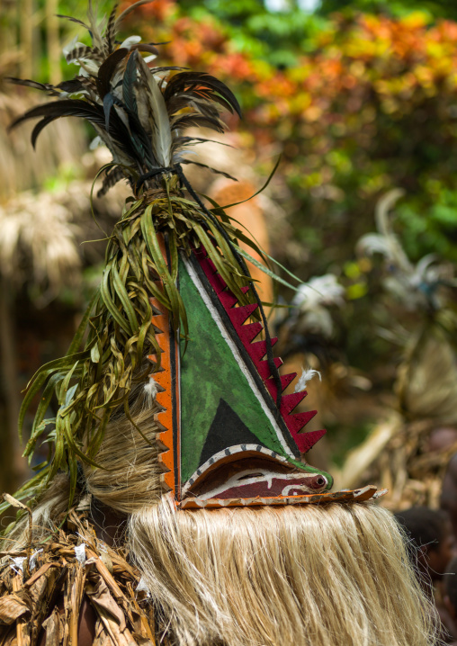 Tribesmen dressed in colorful masks and costumes made from the leaves of banana trees performing a Rom dance, Ambrym island, Fanla, Vanuatu