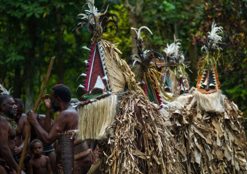 Tribesmen dressed in colorful masks and costumes made from the leaves of banana trees performing a Rom dance, Ambrym island, Fanla, Vanuatu