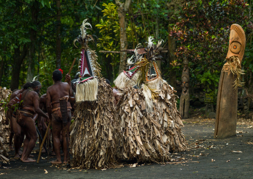 Rom dance masks and giant slit drum during a ceremony, Ambrym island, Fanla, Vanuatu