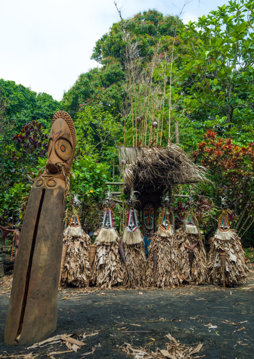 Rom dance masks and giant slit drum during a ceremony, Ambrym island, Fanla, Vanuatu