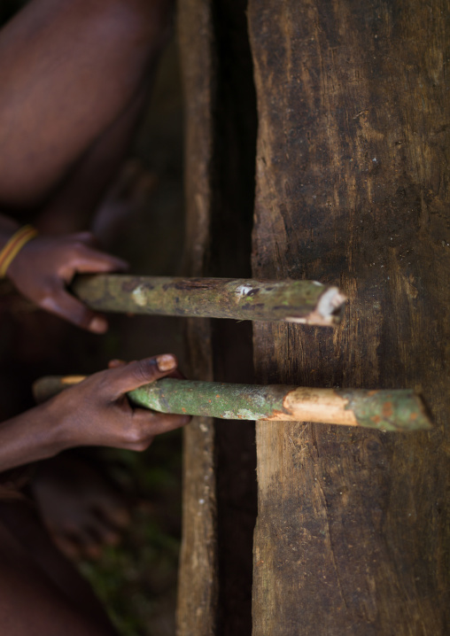 Ni-Vanuatu beating on a slit drum, Sanma Province, Espiritu Santo, Vanuatu