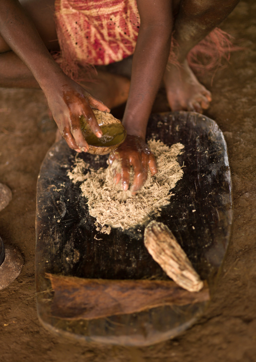 Woman preparing and squeezing kava to drink at a traditional ceremony, Sanma Province, Espiritu Santo, Vanuatu