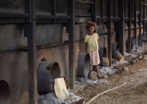 Ni-Vanuatu girl in a copra factory, Sanma Province, Espiritu Santo, Vanuatu