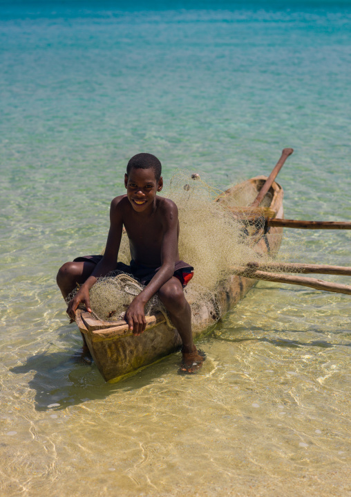 Young boy of the Ni-Vanuatu people in a dugout, Sanma Province, Espiritu Santo, Vanuatu