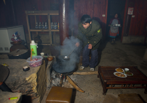 Couple cooking in their kitchen, Sapa, Vietnam