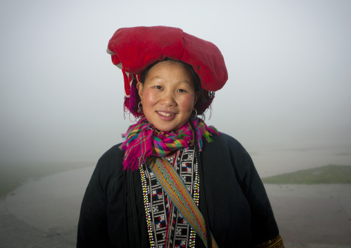 Smiling red dzao woman with traditional headgear, Sapa, Vietnam