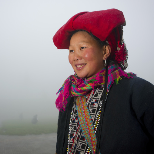 Smiling red dzao woman with traditional headgear, Sapa, Vietnam