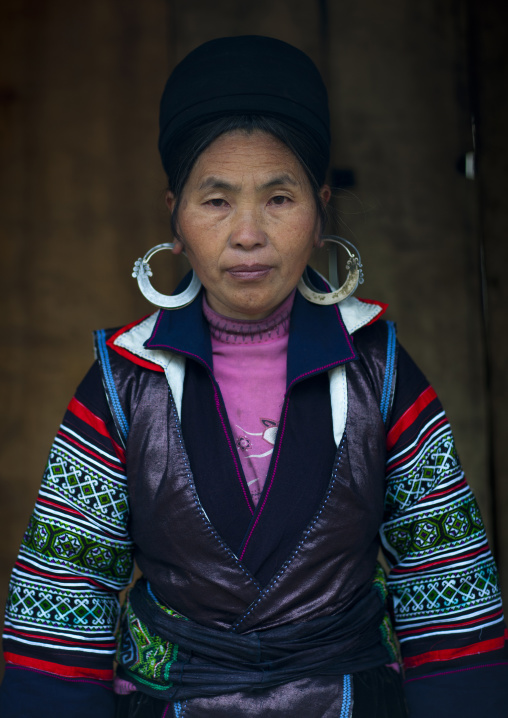 Black hmong woman with traditional headgear and earrings, Sapa, Vietnam