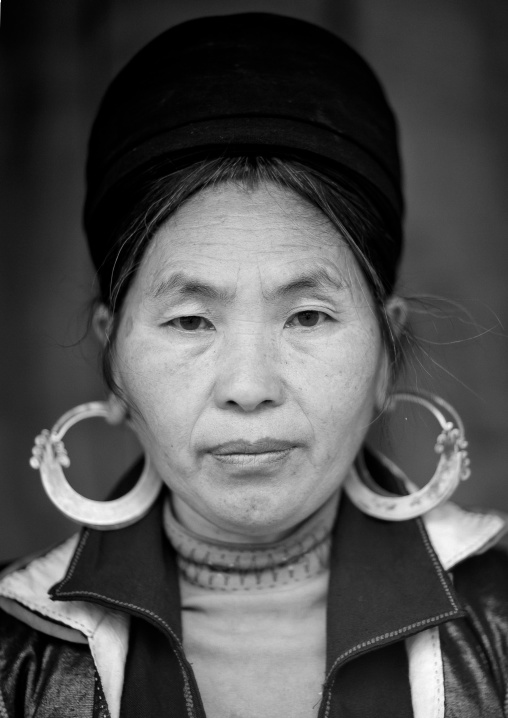 Black hmong woman with traditional headgear and earrings, Sapa, Vietnam