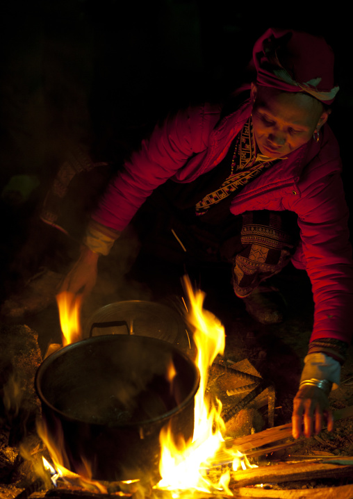 Red dzao woman cooking, Sapa, Vietnam