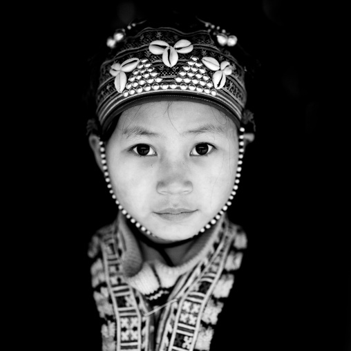 Young red dzao girl with a traditional hat, Sapa, Vietnam