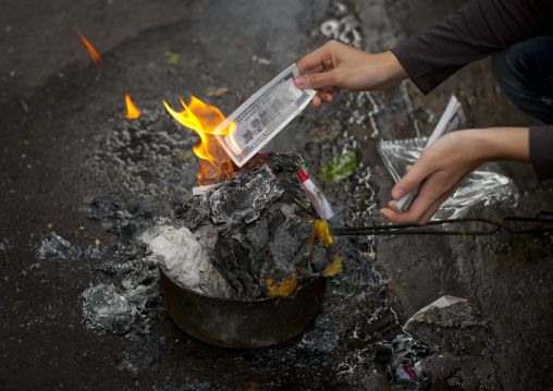 Burning a note as an offering on tet day hanoi, Vietnam