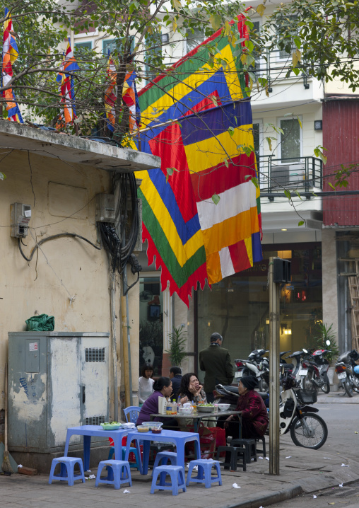 Women eating on the street, Hanoi, Vietnam