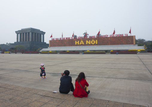 Couple sitting on ba dinh square, Hanoi, Vietnam