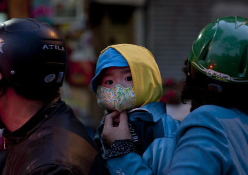 Kid with a scarf on the mouth to protect him from pollution, Sapa, Vietnam