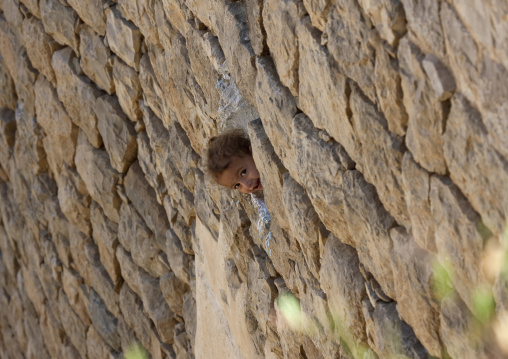 Smiling Girl Showing Up At The Window, Kholan, Yemen