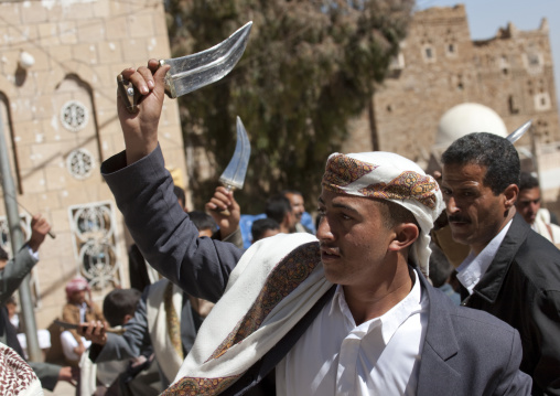 Young Man With Traditional Turban Holding A Jambiya At A Wedding In Thula, Yemen