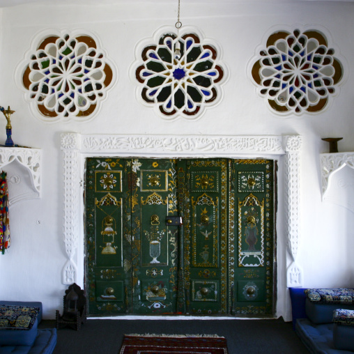 Rose Windows With Stained Glass And Artistically Painted Door Inside An Old House In Sanaa, Yemen