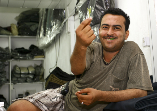 Smiling Man In His Shop Showing A Leaf Of Qat While Chewing, Al Hodeidah Souq, Yemen