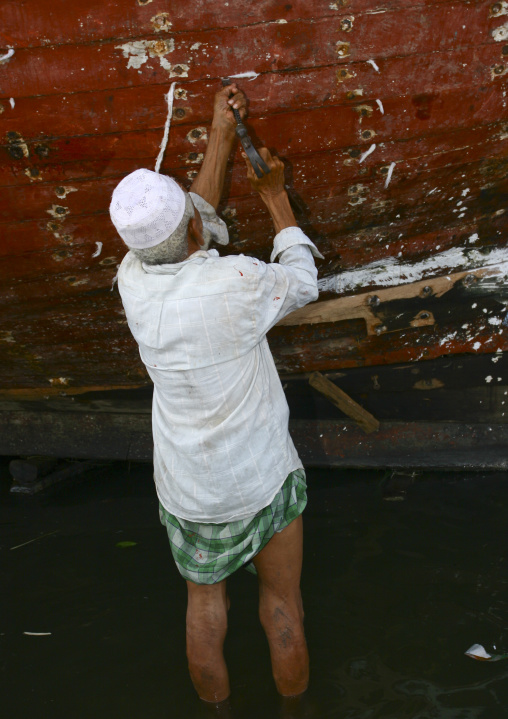 Man Working On The Impermeability Of A Dhow, Al Hodeidah Harbour, Yemen