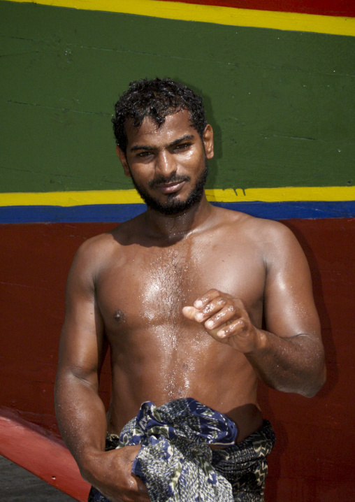 Fisherman Just Coming Back From The Sea Posing In Front Of A Dhow, Red Sea Coast, Mocha, Yemen